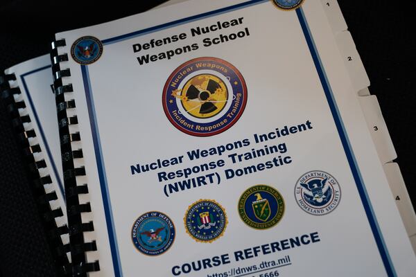 An attendee's copy of a Nuclear Weapons Incident Response Training book is seen during a tabletop exercise simulating the aftermath of a nuclear detonation, at Georgia State University Parc Stadium on Thursday, March 10, 2022, in Atlanta. (Elijah Nouvelage for The Atlanta Journal-Constitution)