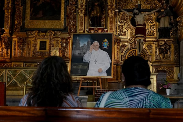 Parishioners pray for the health of Pope Francis at the Metropolitan Cathedral in Mexico City, Thursday, Feb. 27, 2025. (AP Photo/Marco Ugarte)