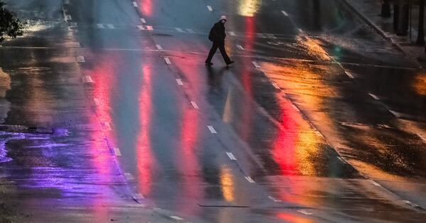 Rain was coming down on 18th Street at West Peachtree Street on Friday morning as Tropical Depression Nicole moved into North Georgia.