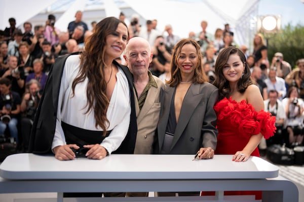 FILE - Karla Sofia Gascon, from left, Jacques Audiard, Zoe Saldana and Selena Gomez pose for photographers at the photo call for the film "Emilia Perez" at the 77th international film festival, Cannes, southern France, on May 19, 2024. (Photo by Scott A Garfitt/Invision/AP, File)