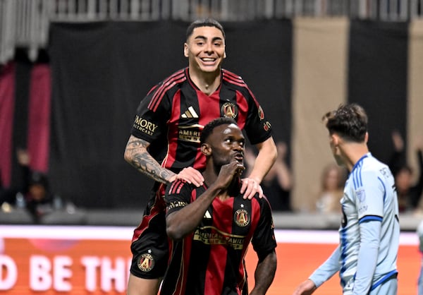 There they are, our perfect angels. Miguel Almiron gives Emmanuel Latte Lath props after Lath's second-half goal Saturday. 