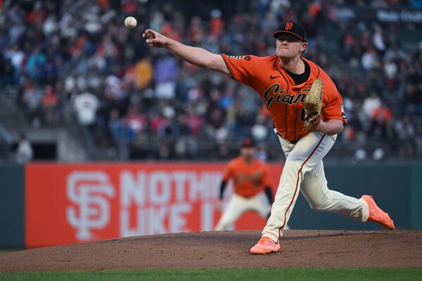 San Francisco Giants pitcher Logan Webb throws to an Atlanta Braves batter during the first inning of a baseball game in San Francisco, Friday, Aug. 25, 2023. (AP Photo/Nic Coury)