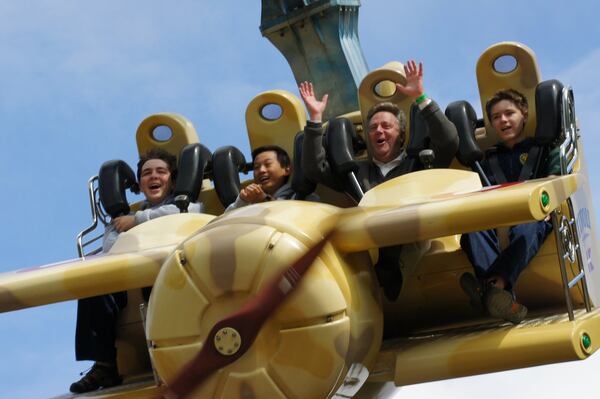 Tom Stokes (second from right) enjoys a break from performing with members of the Georgia Boy Choir at Tivoli Gardens in Copenhagen, Denmark, where he was a chaperone in 2012. Stokes will receive the choir’s Paragon Award this year for his contributions to the choir. CONTRIBUTED BY MONUMENTAL MEDIA