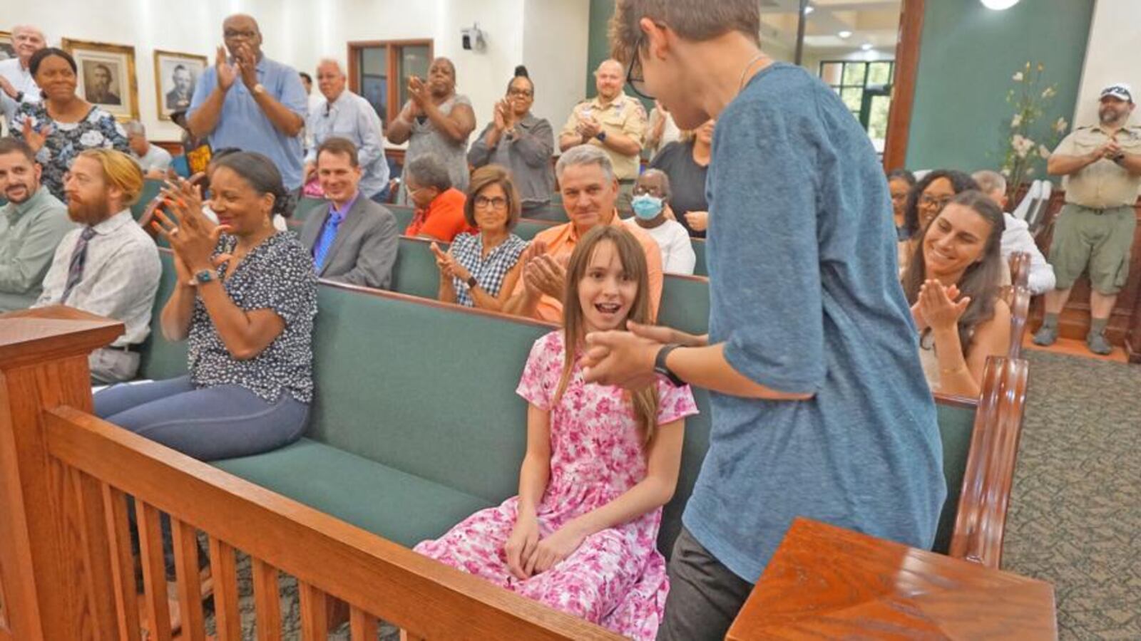 The audience in the McDonough City Hall meeting chambers erupted in applause as Brantley Abbott was recognized. (Courtesy of City of McDonough)