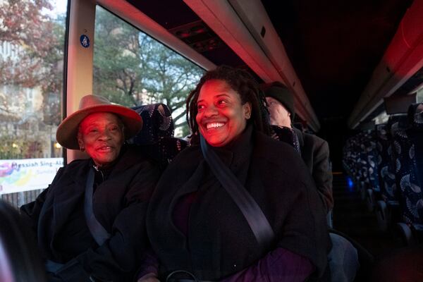 Linda Jones, left, and her daughter Phylena Houde wait in a shuttle bus to go pay respects to former First Lady Rosalynn Carter at the Jimmy Carter Presidential Library and Museum in Atlanta on Monday, Nov. 27, 2023.   (Ben Gray / Ben@BenGray.com)