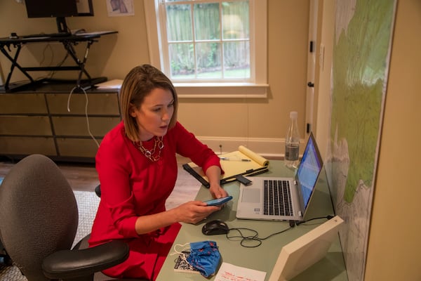 Lyndsey Rudder, Republican candidate for state House District 54,  speaks with her campaign finance director Amy Doehrman in her makeshift basement office at her residence in Atlanta on Sept. 14, 2020.  (Alyssa Pointer / Alyssa.Pointer@ajc.com)