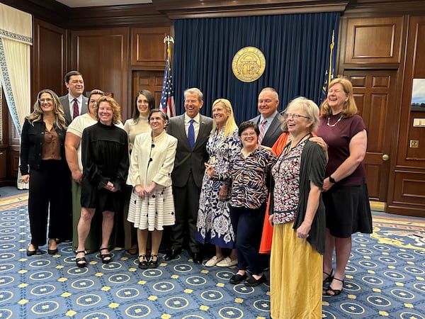 Martha Haythorn of Decatur and other members of the Georgia Council on Developmental Disabilities pose for a picture with Gov. Brian Kemp after their swearing-in ceremony. Haythorn, who has Down Syndrome, wants to spend her life advocating for the rights of the disabled. She is pictured on the front row, second from the right. Courtesy of Georgia Council on Developmental Disabilities