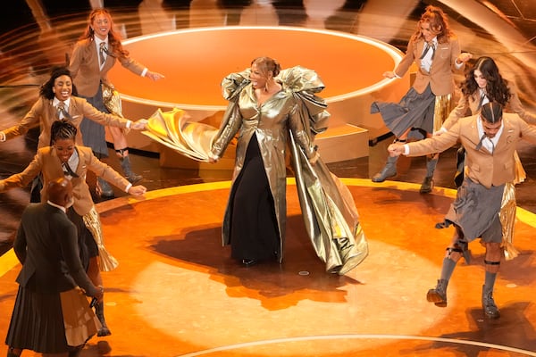 Queen Latifah, center, performs "Ease on Down the Road" during the Oscars on Sunday, March 2, 2025, at the Dolby Theatre in Los Angeles. (AP Photo/Chris Pizzello)