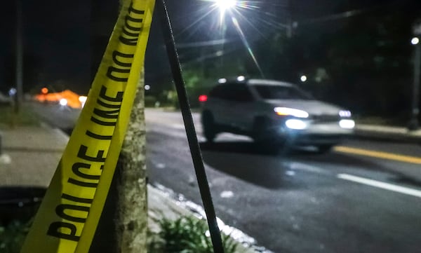 Crime tape remained at the scene at the 2300 block of Martin Luther King Jr. Drive in Atlanta on May 27, 2021, where Atlanta police are investigating after one man was fatally shot and another was found with a stab wound in the same southwest Atlanta neighborhood. (John Spink / John.Spink@ajc.com)


