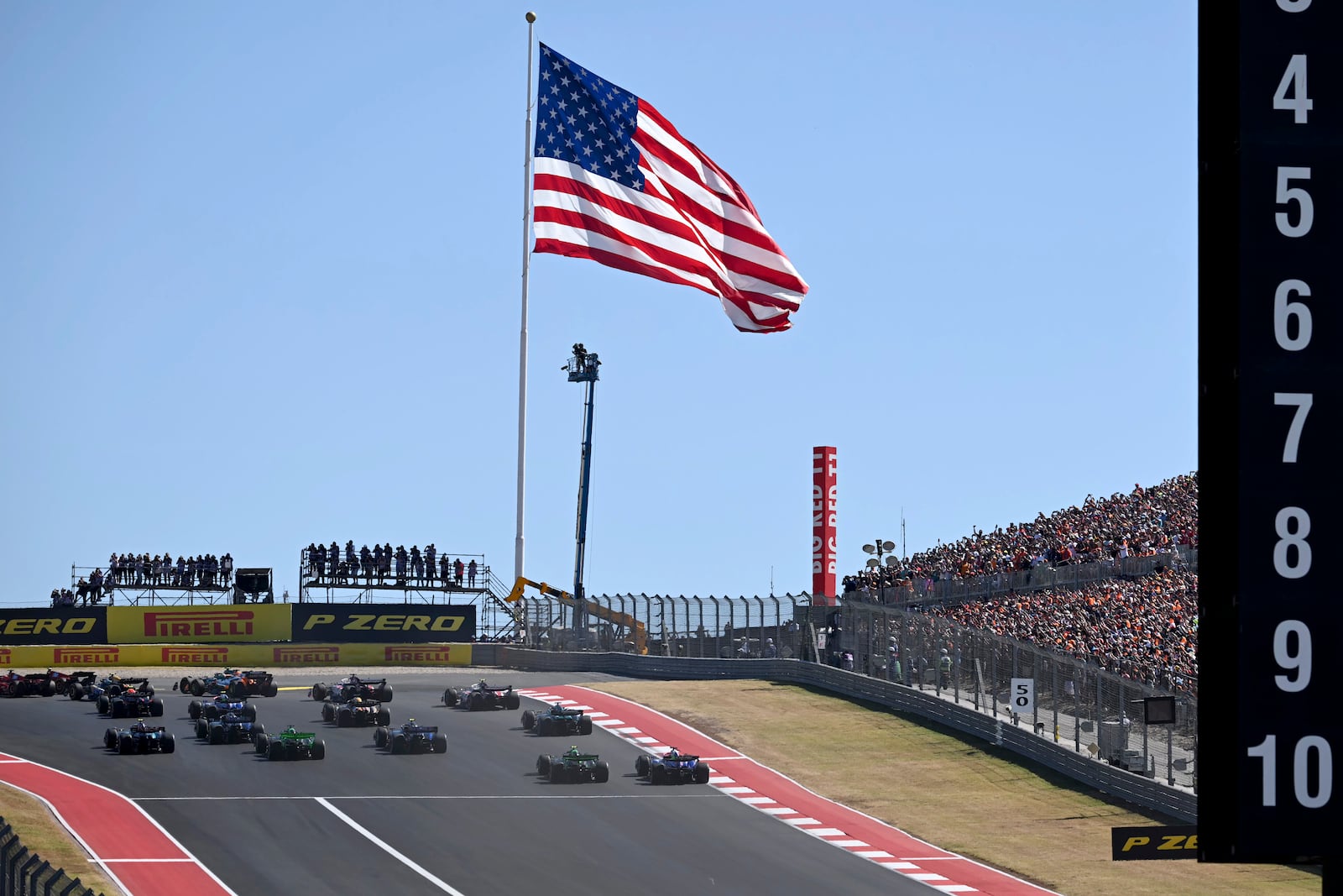 Drivers head into Turn 1 during the F1 U.S. Grand Prix auto race at the Circuit of the Americas, Sunday, Oct. 20, 2024, in Austin, Texas. (Patrick Fallon/Pool Photo via AP)