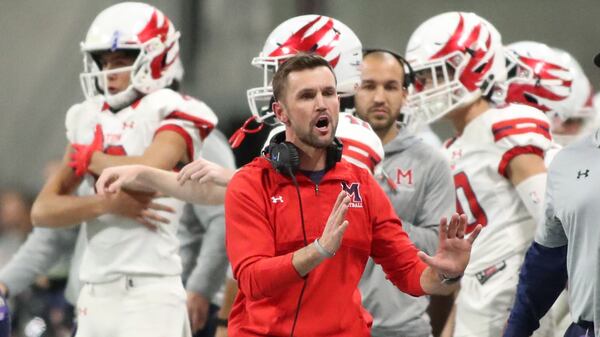 Coach Adam Clack led Milton High School to its first state football championship. (Jason Getz/For the AJC)