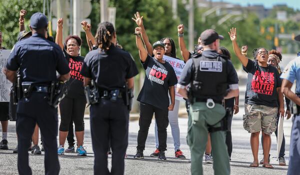 Black Lives Matter members protested in Atlanta last July. Sen. Jeff Sessions has defended controversial statements involving racial attitudes.  JOHN SPINK /JSPINK@AJC.COM