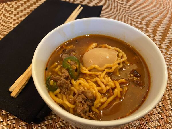 Spicy beef ramen from Publico is a soothing noodle soup on a chilly night. Ligaya Figueras/ligaya.figueras@ajc.com