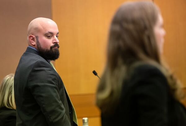 Defense attorney Scott Grubman, left, listens to Senior Assistant Attorney General Blair McGowan during a pre-trial hearing Monday in the case of Jenna Garland. Garland, a former press secretary to former Atlanta Mayor Kasim Reed, has been charged with two misdemeanor counts of violating the Georgia Open Records Act. STEVE SCHAEFER / SPECIAL TO THE AJC