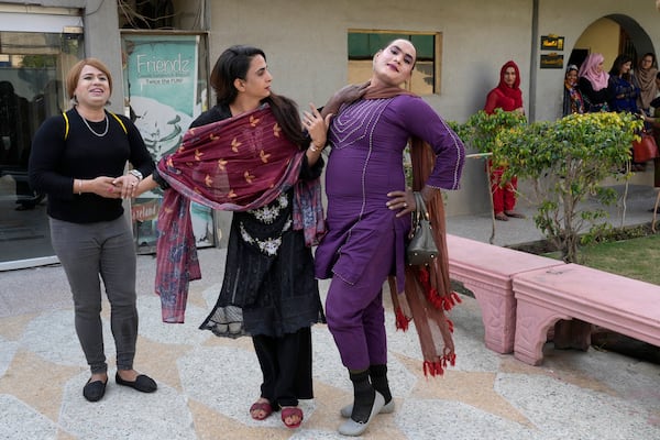 Transgender persons pose for photo after their cooking class at the Culinary & Hotel Institute of Pakistan, in Lahore, Pakistan, Tuesday, Feb. 25, 2025. (AP Photo/K.M Chaudary)