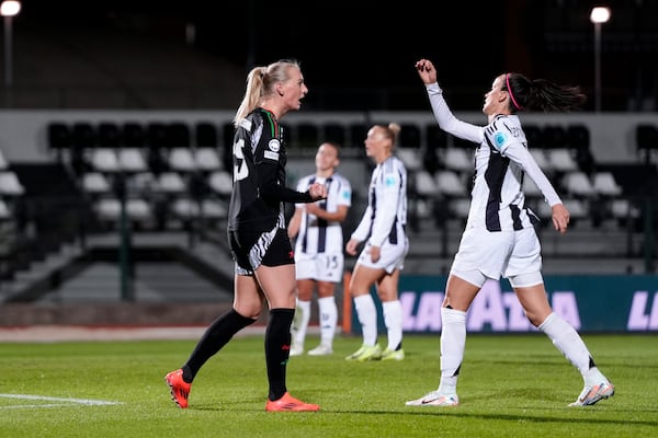 Arsenal's Stina Blackstenius, left, celebrates scoring his side's second goal during the women's Champions League soccer match between Juventus and Arsenal at the Vittorio Pozzo La Marmora Stadium in Biella, Italy, Tuesday, Nov. 12, 2024. (Fabio Ferrari/LaPresse via AP)