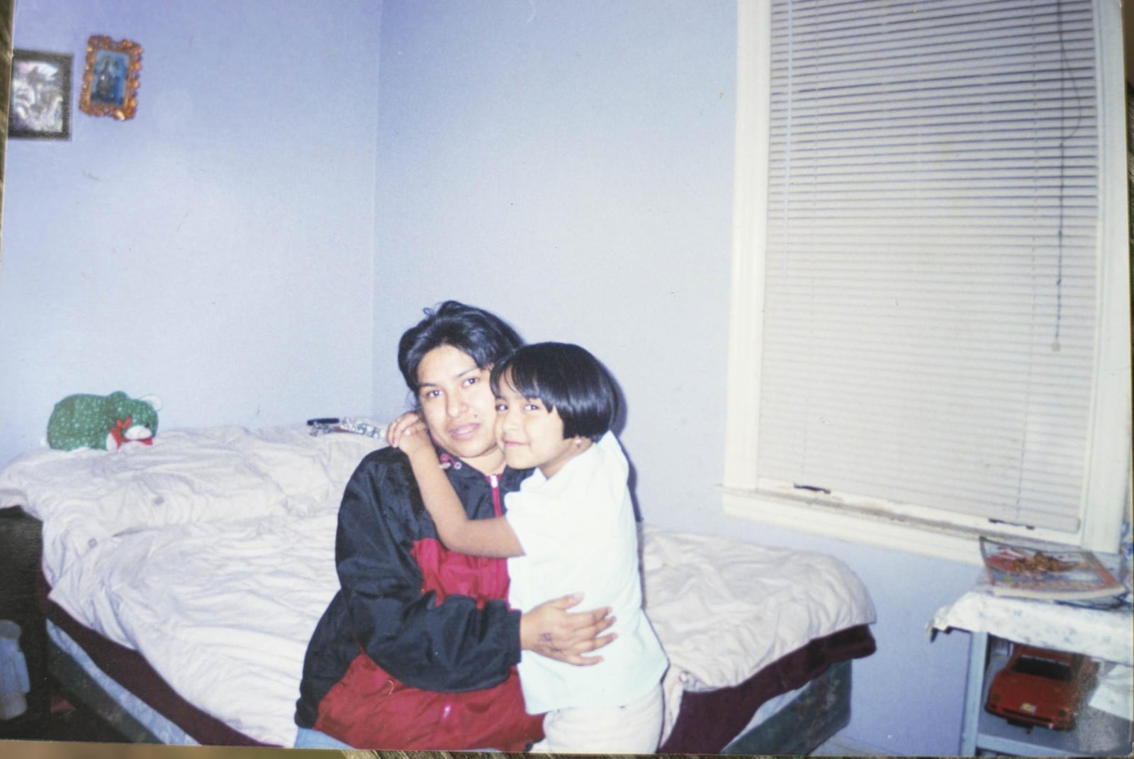 Marisela hugs her mother, Irene, in an old family photo. CONTRIBUTED