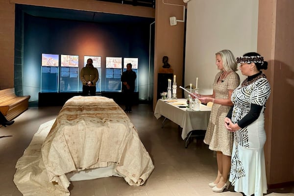 In this photo provided by the Kon-Tiki Museum press service on Wednesday, Nov. 13, 2024, head of the museum Liv Heyerdahl, second from right, attends the "repatriation" ceremony at the Kon Tiki Museum in Oslo, Norway, Tuesday, Nov. 12, 2024. (Kon-Tiki Museum press service via AP)