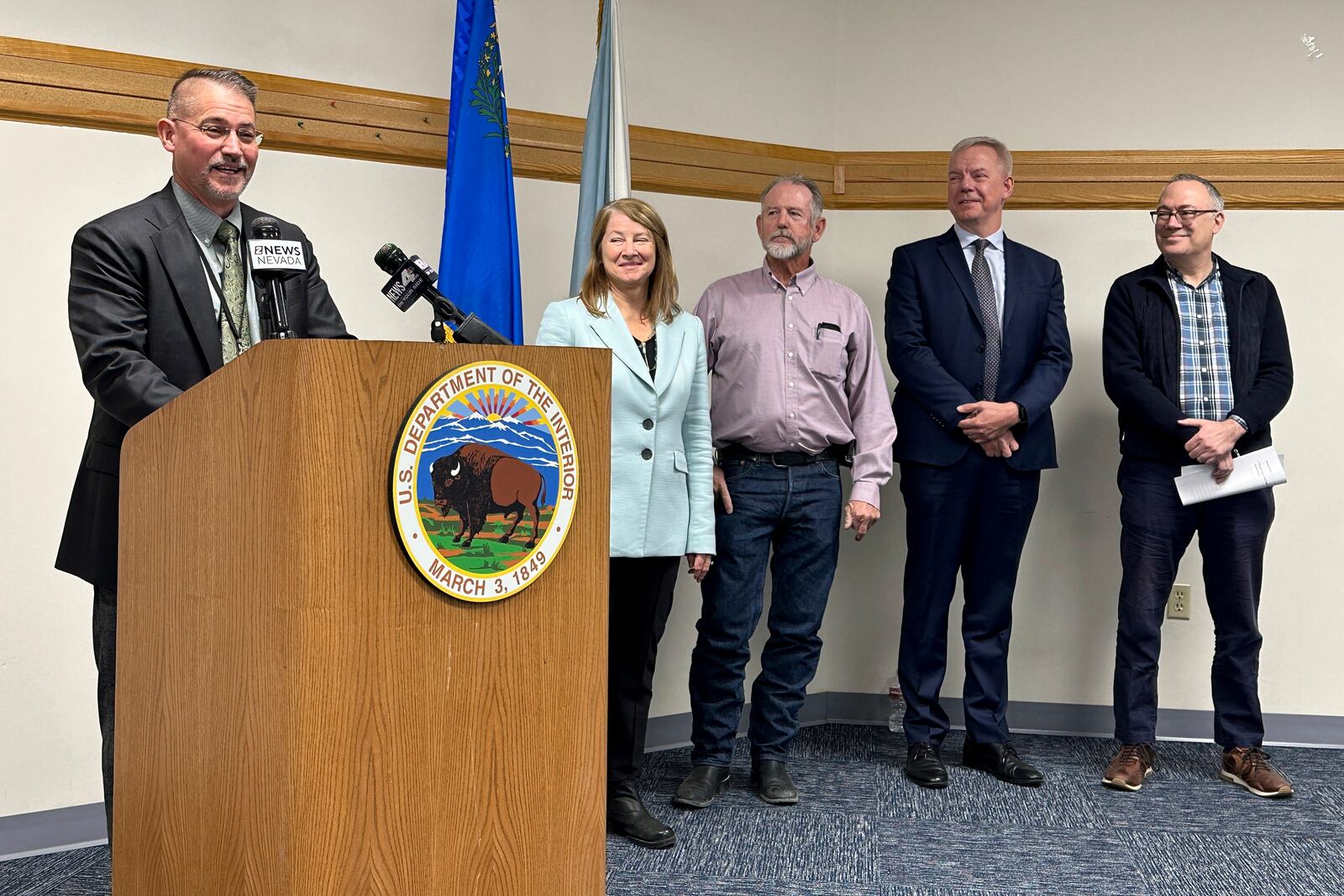 FILE - Jon Raby, left, Nevada state director for the U.S. Bureau of Land Management, speaks to reporters at BLM state headquarters in Reno, Nev., Thursday, Oct. 24, 2024, during a news conference announcing approval of a federal permit for Ioneer Ltd.'s lithium-boron mine now scheduled to begin construction next year near the California line about halfway between Reno and Las Vegas. Others who participated include, from left, Acting Deputy U.S. Interior Secretary Laura Daniel-Davis, Esmeralda County Commissioner Ralph Keys, Ioneer CEO Bernard Rowe and Steve Feldgus, principal deputy assistant U.S. interior secretary for land and minerals management. (AP Photo/Scott Sonner, File)