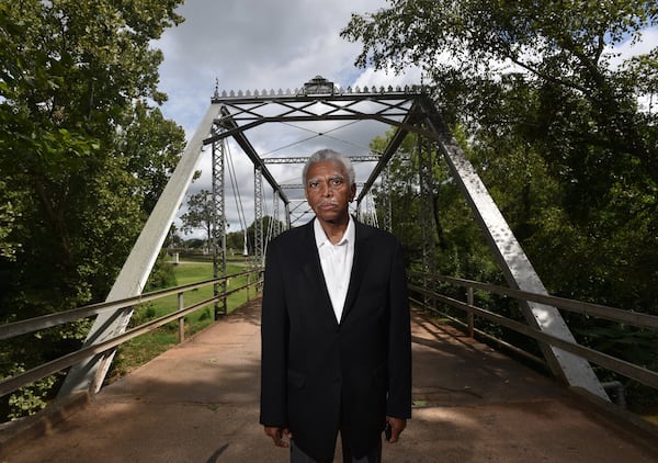 Fred Smith at a bridge in Oconee Hill Cemetery in Athens where slave remains once buried on the nearby University of Georgia campus were reinterred in March 2017. Smith, a UGA alumnus, has been urging university officials since the remains were discovered in 2015 to offer a proper memorial that recognizes the slaves and their contributions to the university in its early decades. A granite memorial recognizing the individuals and other slaves is slated to be installed on the front lawn of Baldwin Hall during fall semester. HYOSUB SHIN / HSHIN@AJC.COM