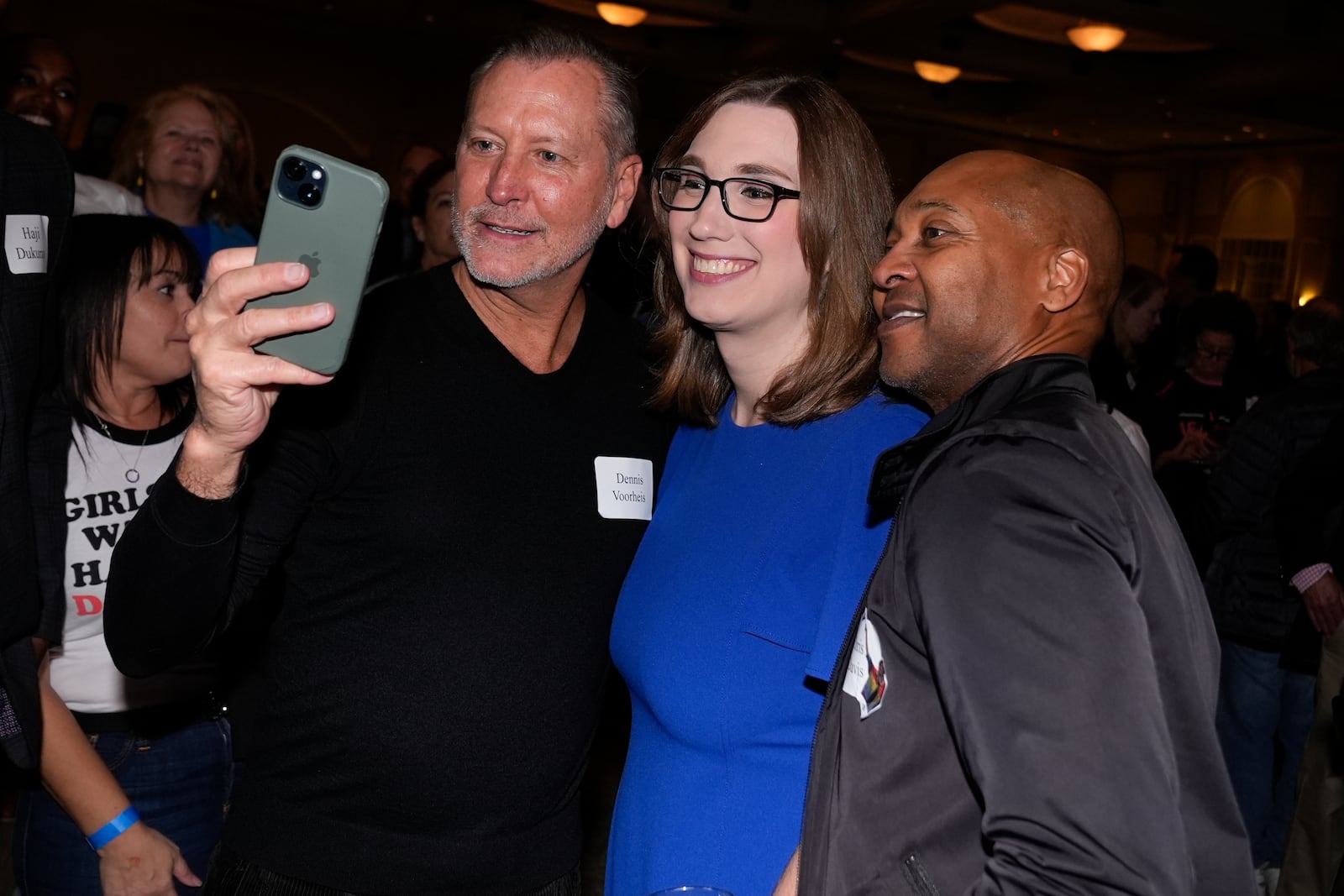 Sarah McBride, Democratic candidate for Delaware's at-large congressional district, takes a selfie with supporters during an election night watch party Tuesday, Nov. 5, 2024, in Wilmington, Del. (AP Photo/Pamela Smith)