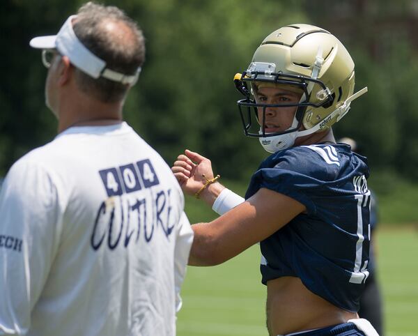 Georgia Tech quarterback Jordan Yates (13) looks for assistance as he calls a play.