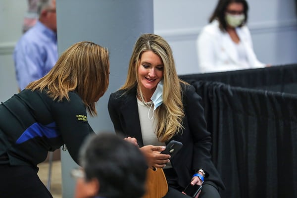 U.S. Sen. Kelly Loeffler looks at her phone before the beginning of the roundtable discussion at the Waffle House corporate offices in Norcross on Friday, May 22, 2020. The event was held as part of VIce President Mike Pence's trip to metro Atlanta. (Photo: JOHN SPINK/JSPINK@AJC.COM)