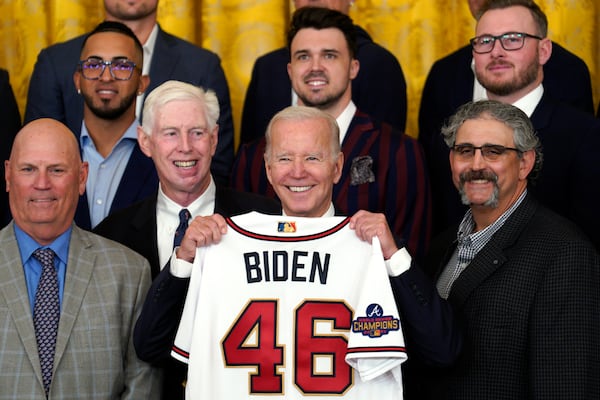 President Joe Biden is presented a jersey as he welcomes the Atlanta Braves to the White House as winners of the 2021 World Series. Boosters aiming to make Atlanta host of the 2024 Democratic National Convention used the event to lobby Biden, who would make the choice. (Yuri Gripas/Abaca Press/TNS)