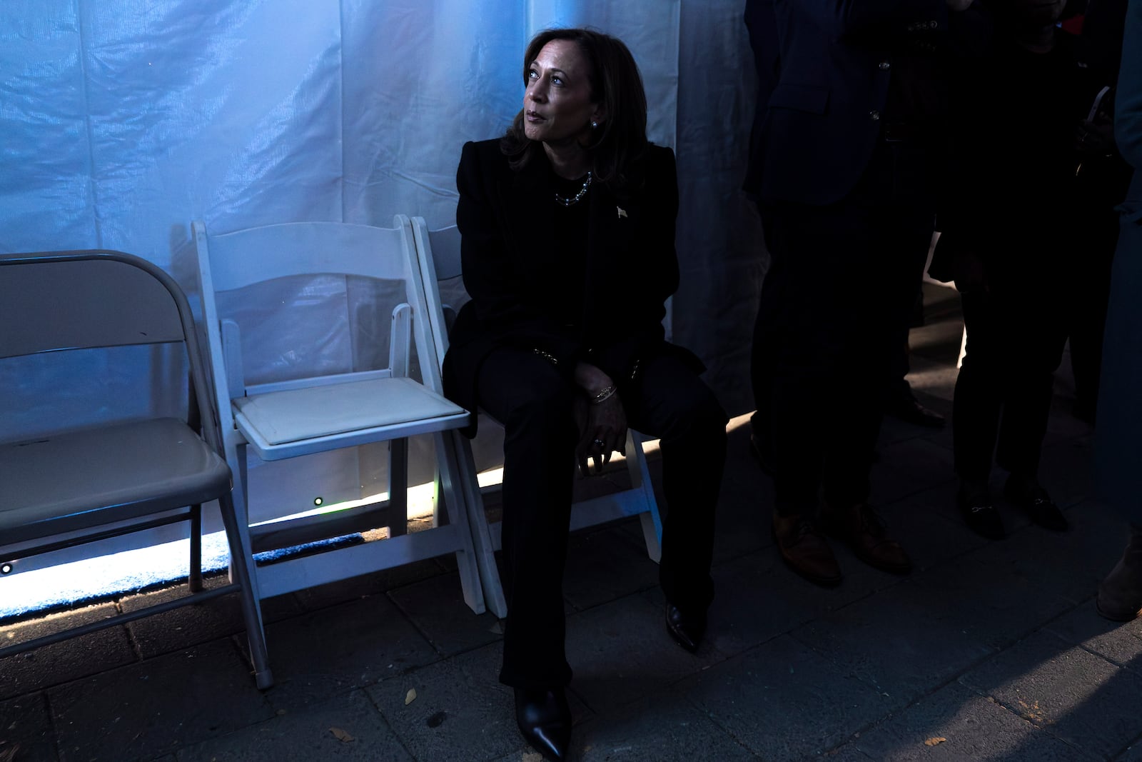 Vice President Kamala Harris looks at a monitor of the event just before taking the stage for her final campaign rally in Philadelphia on Monday.