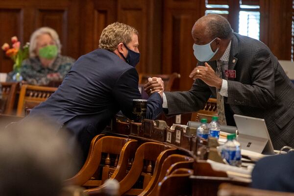 03/08/2021 —Atlanta, Georgia — Governor House Floor Leader Rep. Bert Reeves (R-Marietta) revives a congratulatory hand shake from  Rep. Al Williams (D-Midway), right, after the House passed HB 479 in the House Chambers during crossover day in the legislative session at the Georgia State Capitol in Atlanta, Monday, March 8, 2021. (Alyssa Pointer / Alyssa.Pointer@ajc.com)