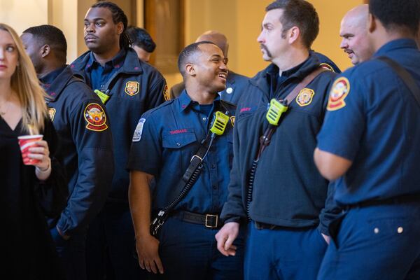 Firefighters wait to be recognized by the House of Representatives at the Georgia Capitol on Thursday.