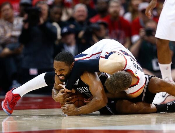 Atlanta Hawks guard Kyle Korver (26) and Brooklyn Nets guard Alan Anderson (6) scramble for a lose ball in the first half of an first-round NBA playoff basketball game Wednesday, April 29, 2015, in Atlanta. (AP Photo/John Bazemore) Did this look desperate enough for you? (AP Photo/John Bazemore)