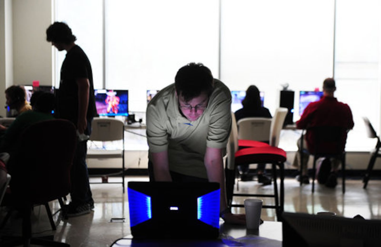 Stewart Chisam, vice president of game operations at Hi-Rez Studios in Alpharetta, mans a computer in the testing room for the company's new game, Global Agenda. 