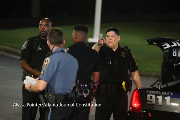 DeKalb and Gwinnett County police investigate a shooting at a BP gas station in the Smoke Rise community of Stone Mountain. ALYSSA POINTER / ALYSSA.POINTER@AJC.COM