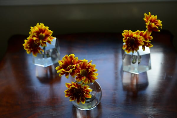 A trio of mini vases and flowers add a punch of color to a table underneath a window in the Vinings townhome. Text by Lori Johnston and Keith Still/Fast Copy News Service. (Christopher Oquendo Photography/www.ophotography.com)