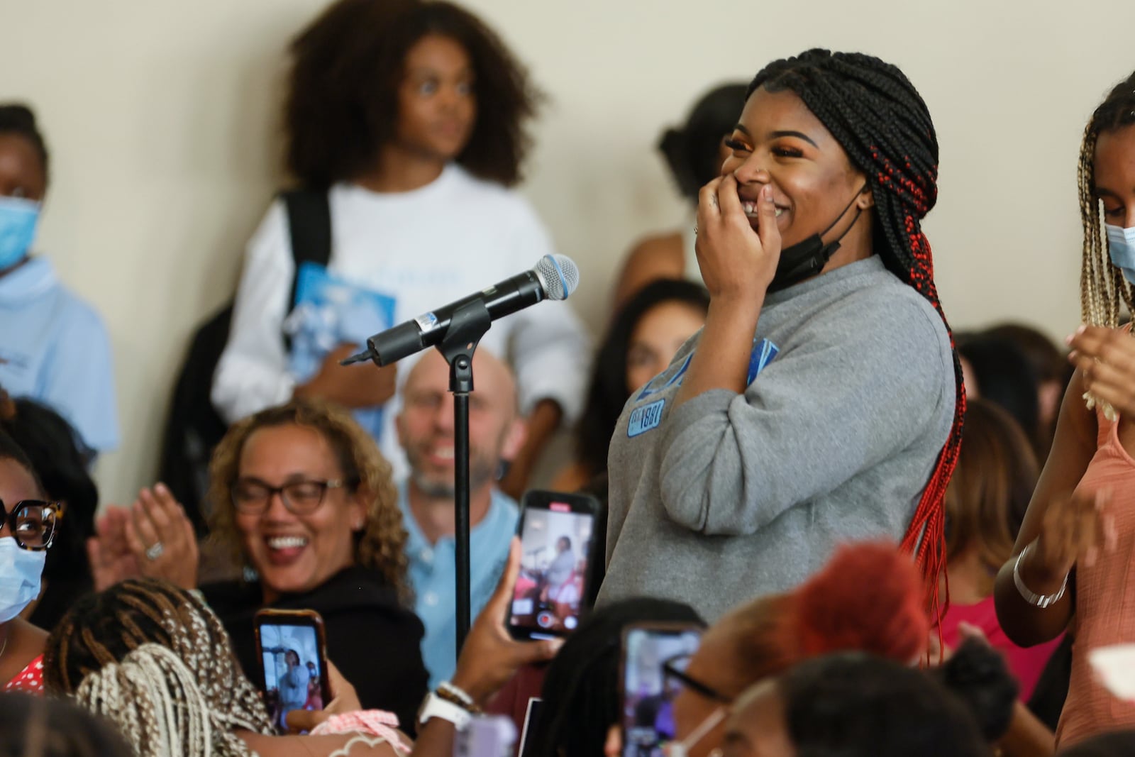 Spelman College student Peyton "Red" Leonard smiles after singing a song for singers Brandi Carlile and Alicia Keys following a conversation about social justice on Friday, September 23, 2022. (Natrice Miller/natrice.miller@ajc.com)  