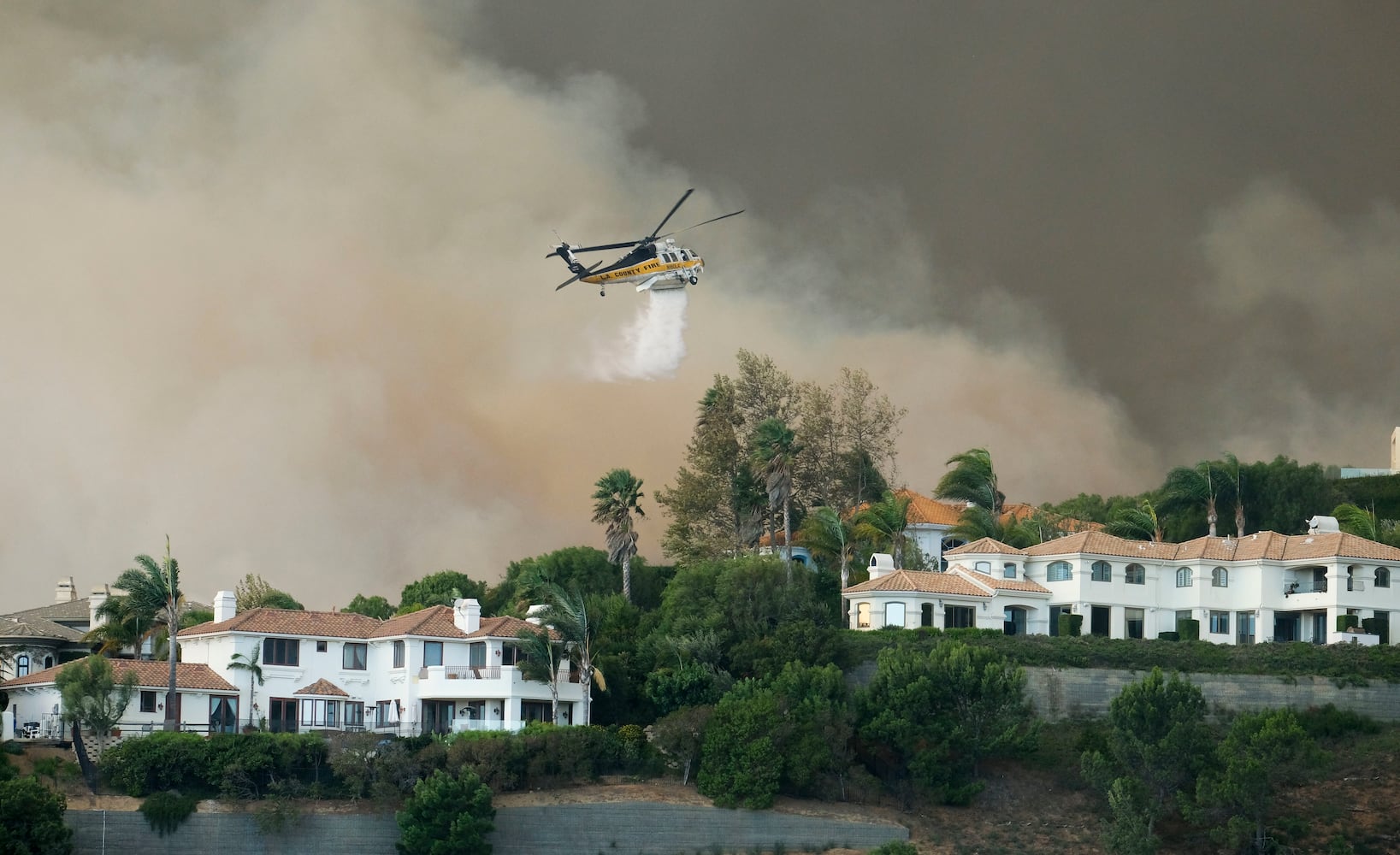 Photos: Deadly wildfires blaze through northern, southern California