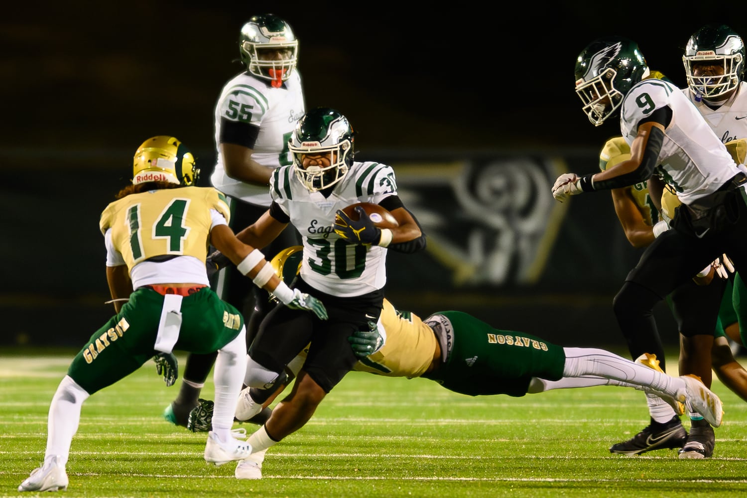 Collins Hill's Maddox Henderson runs the ball. (Jamie Spaar for the Atlanta Journal Constitution)