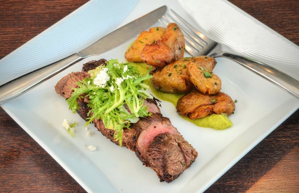 The Beef Petite Tender is paired with crispy potatoes atop a smoked-asparagus puree. CONTRIBUTED BY CHRIS HUNT PHOTOGRAPHY