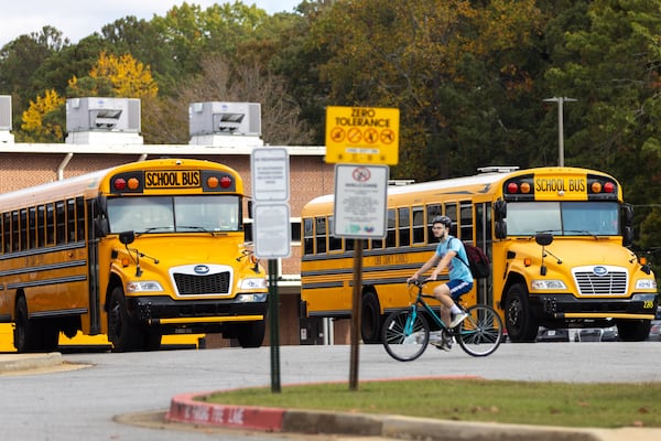 A bicyclist rides through the campus of Orme Campbell Middle School in Smyrna on Friday, November 8, 2024. (Arvin Temkar / AJC)