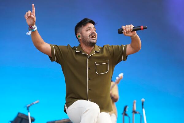 Sameer Gadhia, of the band Young the Giant, performs on Day 3 of the Lollapalooza music festival, Saturday, July 31, 2021, at Grant Park in Chicago. (Photo by Rob Grabowski/Invision/AP)