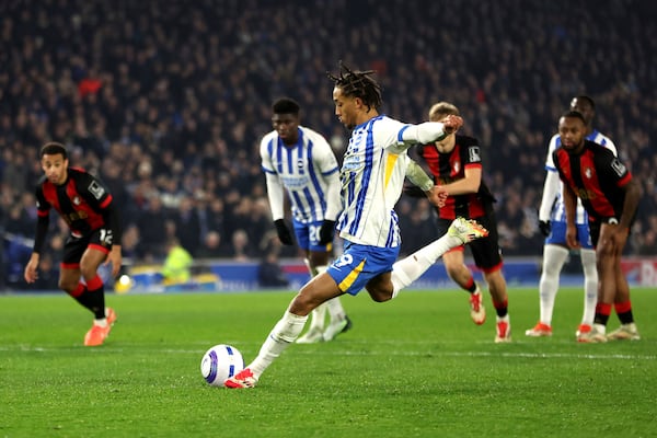 Brighton and Hove Albion's Joao Pedro scores his side's first goal of the game from the penalty spot during the English Premier League soccer match between Brighton and Hove Albion and AFC Bournemouth, at American Express Stadium, Brighton, England, Tuesday Feb. 25, 2025. (Steven Paston/PA via AP)