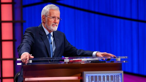 This July 17, 2018 image released by Jeopardy Productions shows host Alex Trebek sporting a beard during a taping of "Jeopardy!" in Culver City, Calif. Trebek sported a beard as he launched the 35th season of "Jeopardy!" and the look has led to a poll. (Carol Kaelson/Jeopardy Productions via AP)