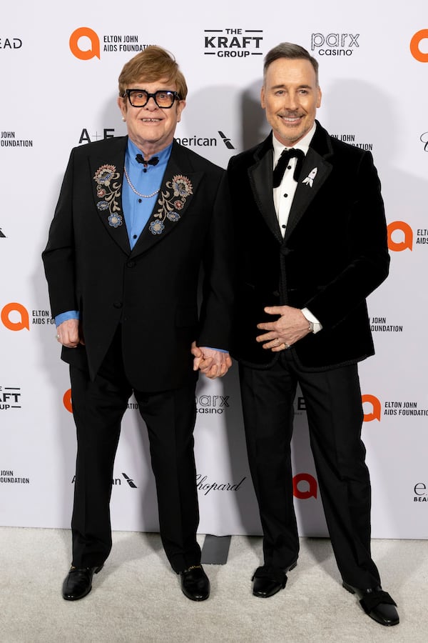 Elton John, from left, Chapell Roan and David Furnish arrive at the 33rd Annual Elton John AIDS Foundation Academy Awards Viewing Party on Sunday, March 2, 2025, in West Hollywood, Calif. (Photo by Willy Sanjuan/Invision/AP)