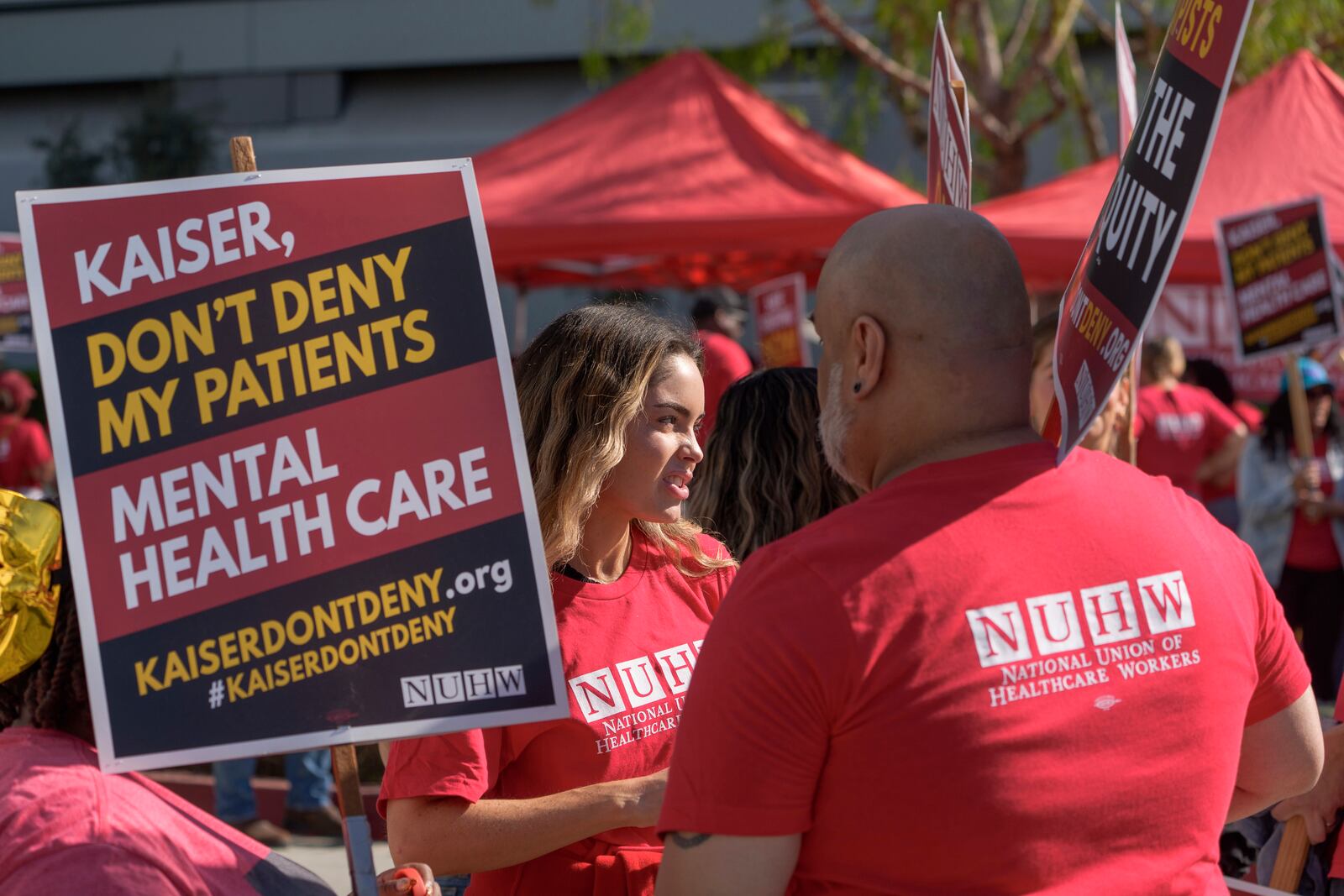 Mental health workers with the National Union of Healthcare Workers (NUHW) outside a Kaiser Permanente facility in Los Angeles Monday, Oct. 21, 2024. (AP Photo/Damian Dovarganes)