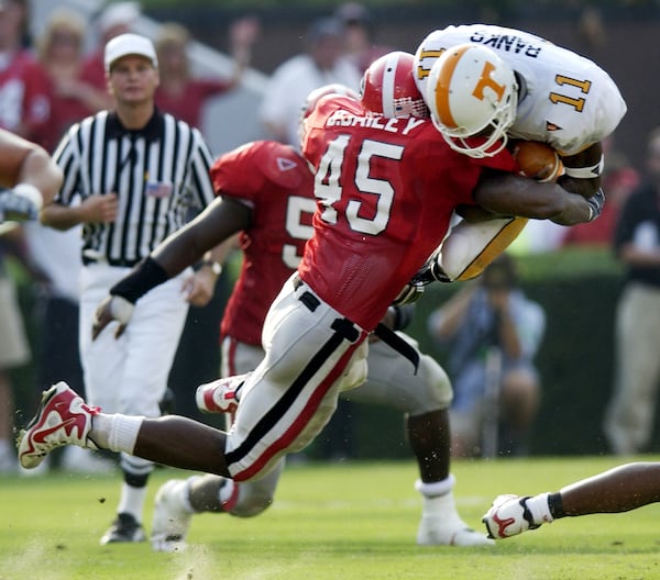 Tennessee quarterback James Banks (11) is stopped by Georgia linebacker Boss Bailey (42) in the second quarter Saturday, Oct. 12, 2002, in Athens, Ga.. (AP Photo/Alan Mothner)