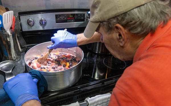 Mike Massey works on making one of his jam recipes in the kitchen of his Decatur home. PHIL SKINNER FOR THE ATLANTA JOURNAL-CONSTITUTION