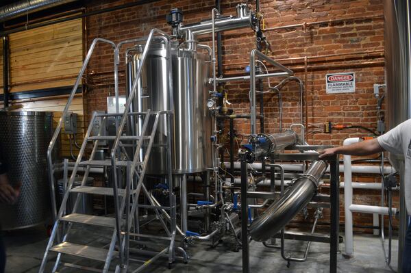 The mash mixer (left) heats water and sugar before cooling down to 80 degrees in the heat exchanger (right)