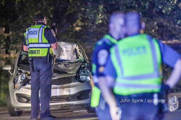 A driver was detained after a pedestrian was hit and killed on Jimmy Carter Boulevard. JOHN SPINK / JSPINK@AJC.COM