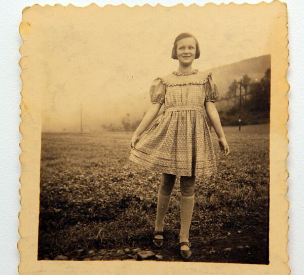 Copy photo of Ilse Reiner wearing a pretty dress in a field in 1939 when the war was just breaking out. She talks about finding "moments of daylight" through the horror and eloquently shares her remarkable story of survival. PHIL SKINNER / PSKINNER@AJC.COM 



